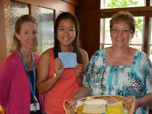 Bishop Fenwick High School Senior Joie Dillion delivers prayer squares to Care Dimensions Kaplan Family Hospice House