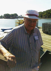 Care Dimensions hospice patient Bill McPherson waits for lobster boats to arrive at Beverly docks