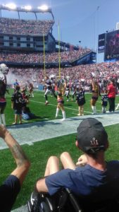 Tom Brady and New England Patriots take field Care Dimensions hospice patient Steve Brown watches
