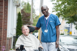 John Driscoll with Care Dimensions hospice aide outside in Salem Massachusetts
